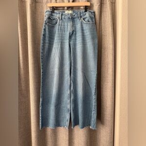 Abercrombie Curve Love wide leg jeans with raw hem.